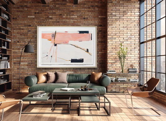 Modern living room with brick wall, green sofa, and abstract art