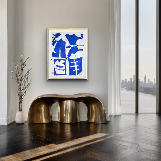 Modern interior with a gold bench, abstract blue artwork, and a cityscape view.