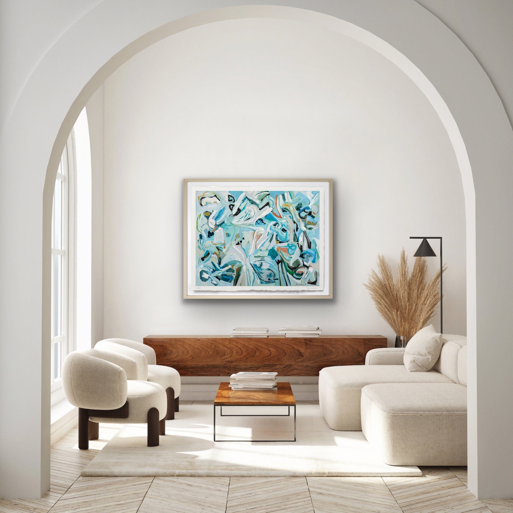 Modern living room with abstract artwork on the wall, neutral furniture, and a wooden coffee table.