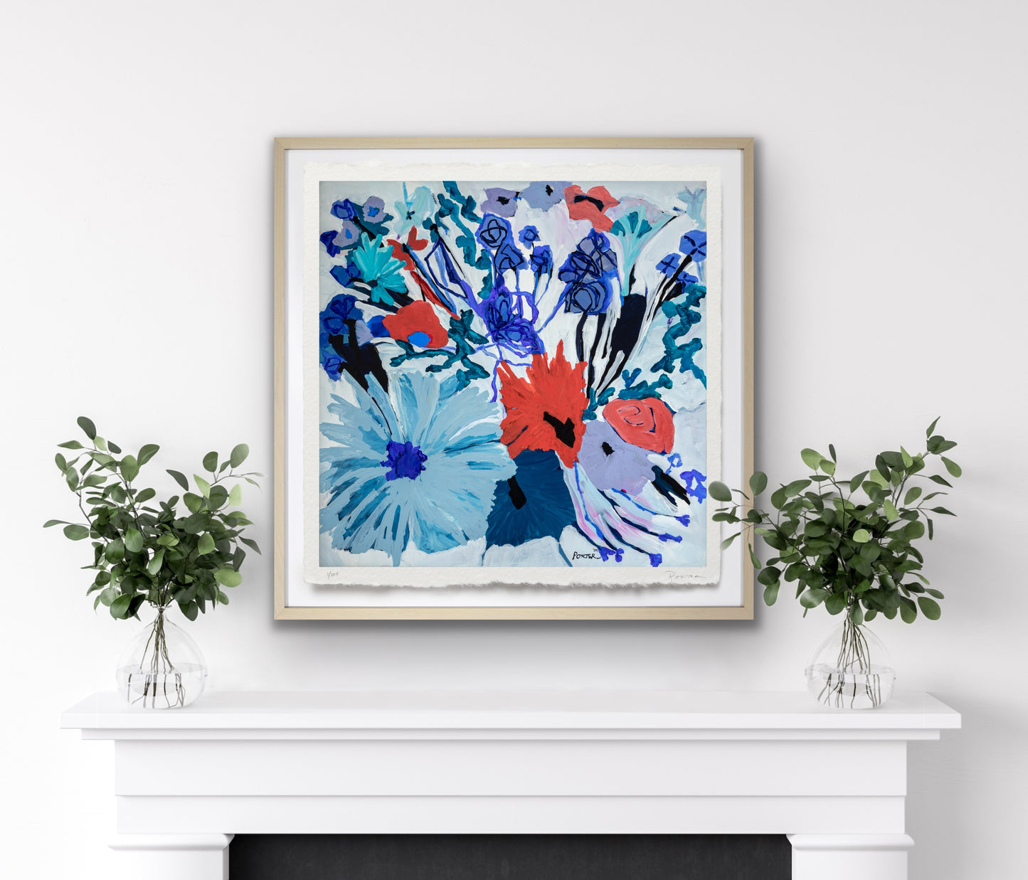Framed abstract artwork on a white wall on mantle