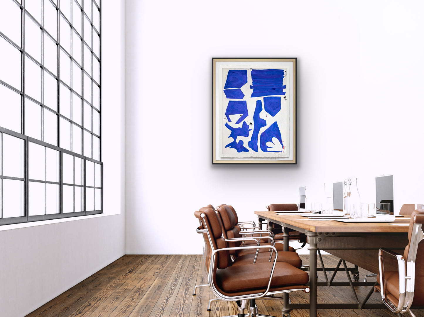 Modern office interior with a blue abstract artwork on the wall.