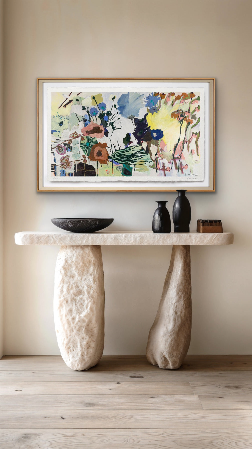 Modern interior with a console table, abstract painting, and decorative items.